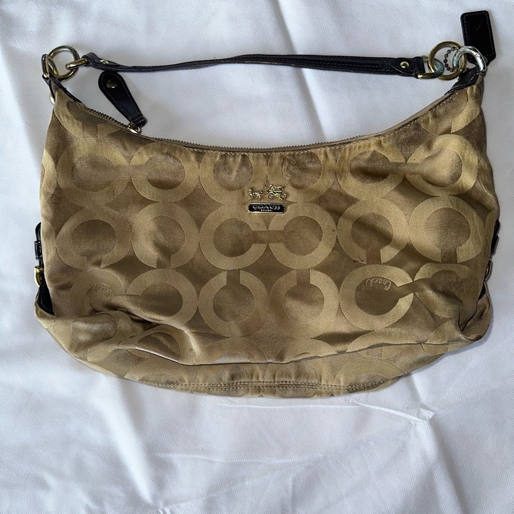 Tan genuine coach brand handbag.